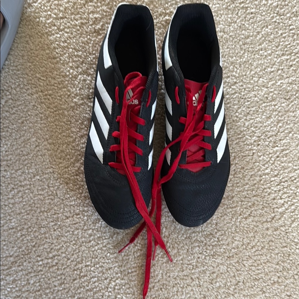 Adidas Black and White cleats with Red Accents